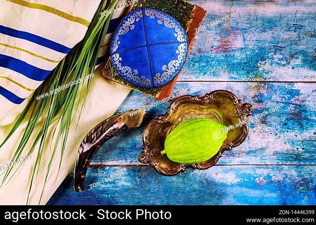 Jewish ritual festival of Sukkot in the jewish religious symbol Etrog, lulav, hadas arava kippah and shofar tallit praying book