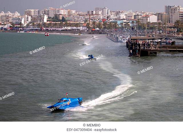 Fast powerboat racing on a river in Portimao, Portugal