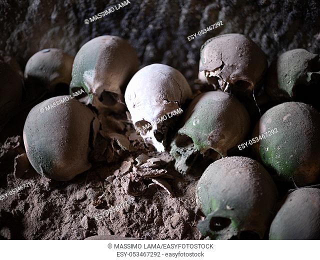 Skull and bones in ancient ossuary, Naples