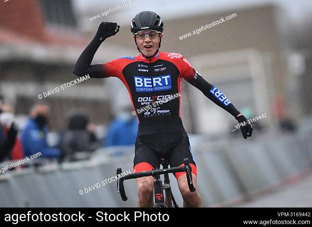 Yordi Corsus celebrates as he crosses the finish line to win the men's juniors race at the Belgian Championships cyclocross cycling in Middelkerke on Saturday...