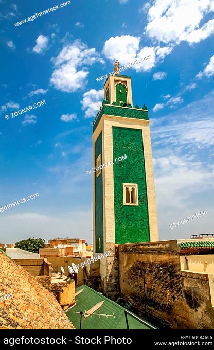 Green minaret of the Great Mosque in the heart of Meknes medina