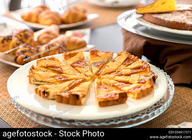 Selection self service continental breakfast buffet display, catering or brunch table food buffet filled with homemade cakes and delicious croissants in a hotel...