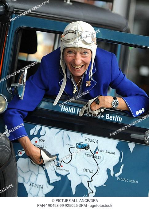 FILED - 24 July 2014, Berlin: Heidi Hetzer, former racing driver, shows her planned route on a Hudson Great Eight vintage car built in 1930