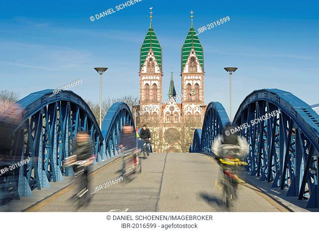 Cyclists, motion blur, Blaue Bruecke bridge, Freiburg im Breisgau, Baden-Wuerttemberg, Germany, Europe