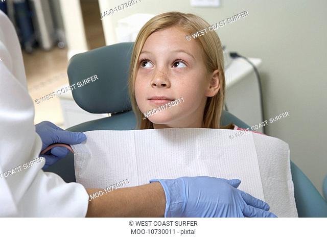 Girl 7-10 at dentists close-up