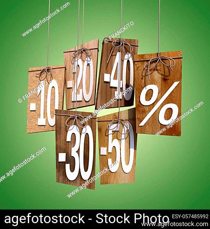 Wooden sales discount tags on a green background