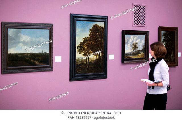 A woman walks through the exhibition during the preview of 'Kosmos der Niederlaender. Die Schenkung Christoph Mueller' in the painting collection of the State...