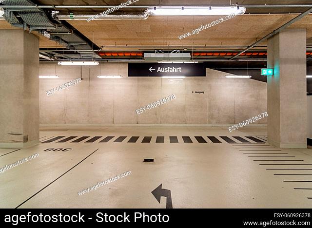 Underground car park with exit sign in German