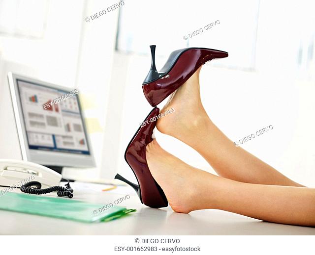 business woman taking off shoes