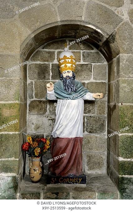 Saint Columban’s Chapel. Village of Saint-Columban, Brittany, France. Statue of Saint Cornely originally from Carnac church