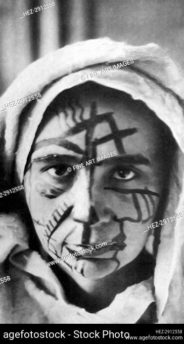 Natalia Goncharova with make-up for the futurist theater, 1913. Creator: Anonymous
