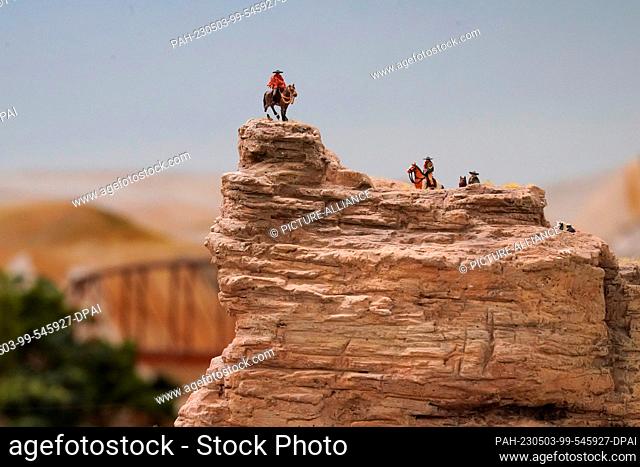 03 May 2023, Hamburg: A group of gauchos stands on a rocky outcrop in the new Patagonia and Argentina section in Miniatur Wunderland