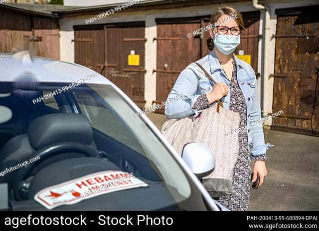 07 April 2020, Hamburg: Wibke Klug, midwife, gets out of her car in the Hamburg district of Eimsbüttel. Klug has already helped hundreds of babies into the...