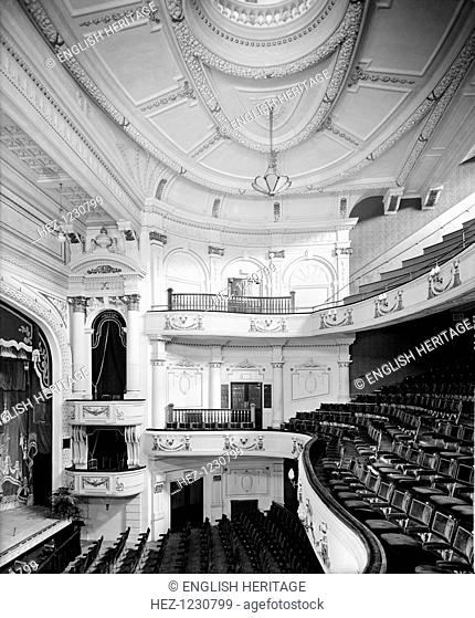 Interior of the Empire Theatre, Penge, Bromley, London, (c1920-c1940?). Showing boxes with pediment above, stalls circle and upper circle