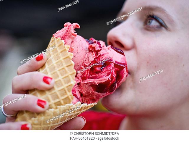 Esther eats a balsamic-strawberry ice cream cone at the 'Christina' ice cream parlour in Frankfurt/Main, Germany, 06 March 2015