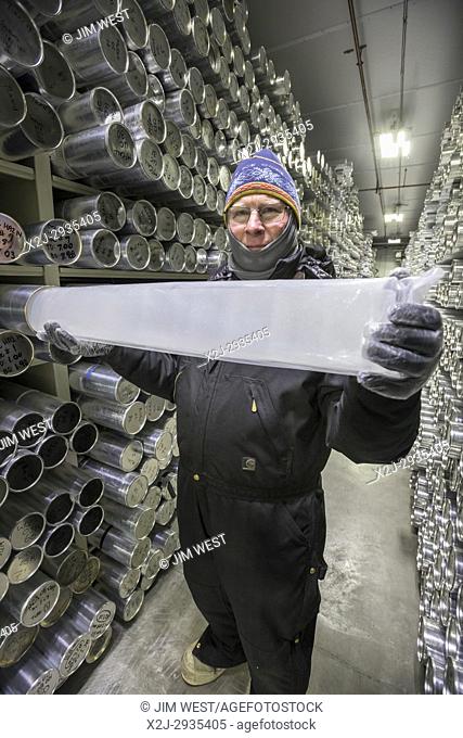 Denver, Colorado - Geoff Hargreaves, curator at the National Ice Core Laboratory, holds a one-meter section of an ice core stored at -36 degrees C (-33 degrees...