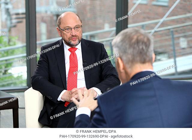 HANDOUT - The handout picture made available shows Germany's Social Democratic Party's (SPD) top candidate Martin Schulz (L) being interviewed by RTL head...