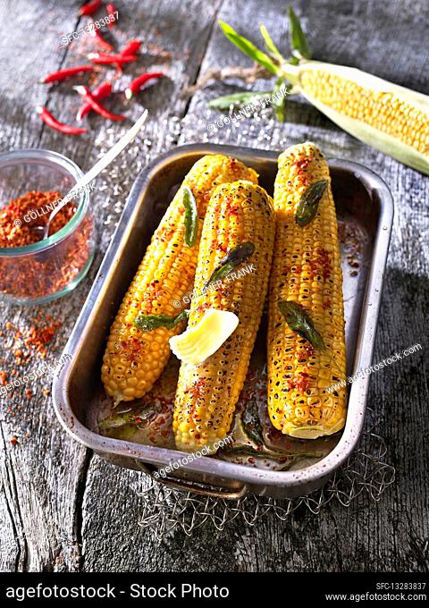Grilled corn cobs with butter, chilli and fresh sage