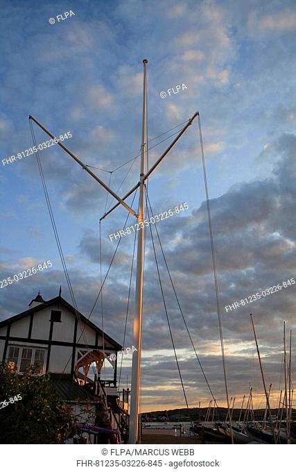 Signal mast at sailing club, in harbour at sunset, Bembridge Harbour, Bembridge, Isle of Wight, England, june