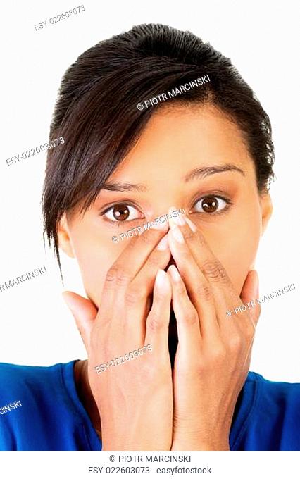 Young scared woman covering the mouth