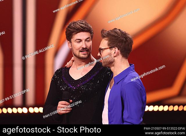 07 May 2021, North Rhine-Westphalia, Cologne: Nicolas Puschmann (l), actor, and Vadim Garbuzov, professional dancer, stand on stage after their dance during the...