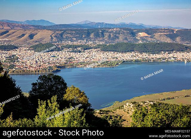 Greece, Epirus, Ioannina, View of Lake Pamvotida and surrounding city in summer