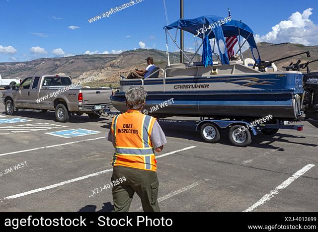 Gunnison, Colorado - Carol Soell, a boat inspector at Curecanti National Recreation Area, checks boats entering and leaving Blue Mesa Reservoir for invasive...