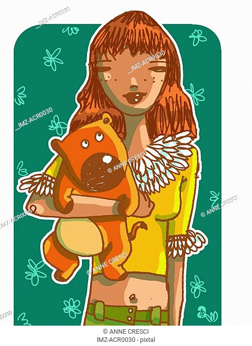 A girl hugging teddy bear