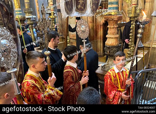 RUSSIA, JERUSALEM - APRIL 9, 2023: Clergymen attend a Palm Sunday service held at the Church of the Holy Sepulchre to mark Christ's triumphal entry into...