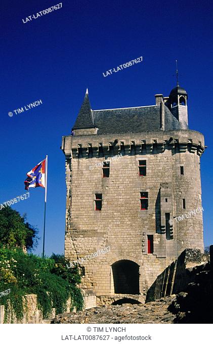 Gatehouse of historic chateau, house. Flag