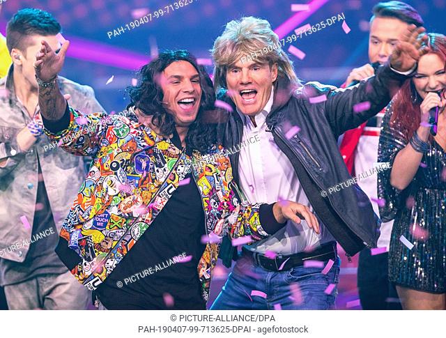 06 April 2019, North Rhine-Westphalia, Köln: Dieter Bohlen (r) and Pietro Lombardi (r), as Thomas Anders, perform the song ""Cheri Cheri Lady"" with wigs and...