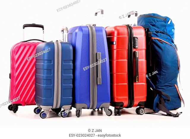 Suitcases and rucksack isolated on white