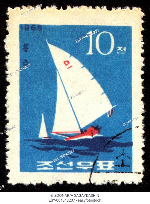 DPRK - CIRCA 1965: A stamp printed in DPRK North Korea shows yacht in a sea