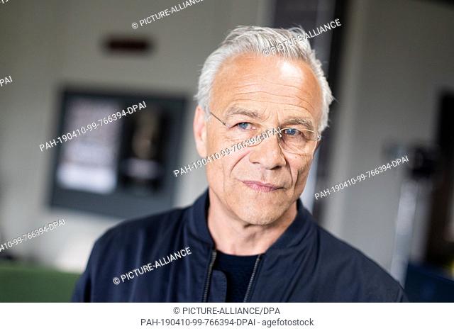 10 April 2019, North Rhine-Westphalia, Köln: Klaus J. Behrendt (as Commissioner Max Ballauf), actor, stands in the new commissariat during the shooting of the...