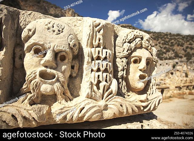 View of the carved stone faces around the ancient amphitheatre ruins of Myra, Demre, Antalya Region, Turkish Riviera, Turkey, Europe