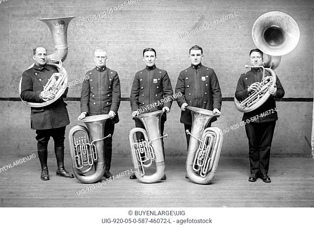 Police Tuba Quartet in Uniform with instruments