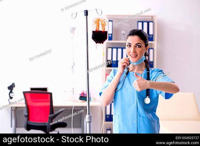 Young female doctor in infusion concept