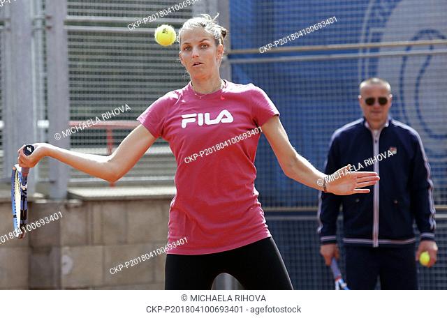 Czech tennis player Karolina Pliskova (left) trains after the press conference on the J&T Banka Prague Open tennis tournament with her fitness coach Marek...