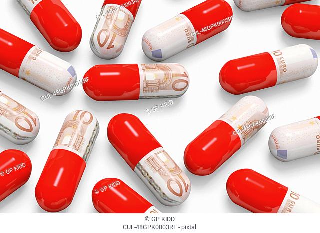 Pills decorated with euro notes