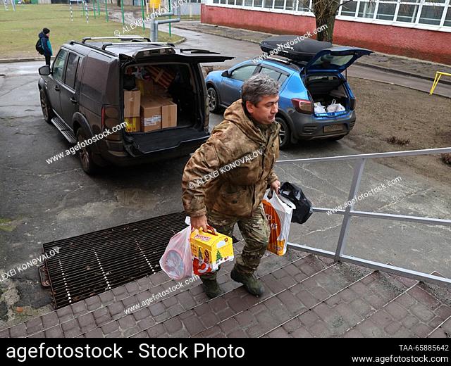 RUSSIA, ZAPOROZHYE REGION - DECEMBER 18, 2023: Unloading humanitarian aid collected by Moscow and Sevastopol school students for schoolNo 4 in the town of...