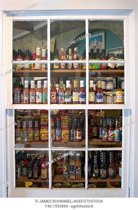Hot sauce bottles in a window at The Market, Charleston, South Carolina