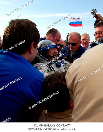 Expedition 30 flight engineer and Russian cosmonaut Anatoly Ivanishin is seen smiling as he is extracted from the Soyuz TMA-22 spacecraft shortly after the...