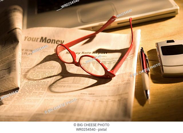 Glasses on newspaper