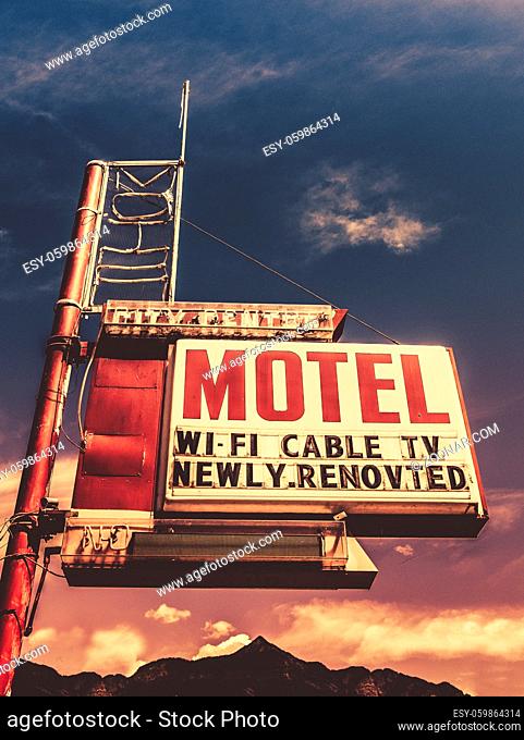 Retro Vintage Image Of Old Motel Sign In Small Town USA In The Mountains