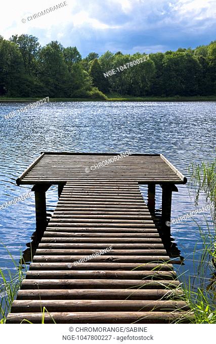 wooden landing stage and an idyllic lake