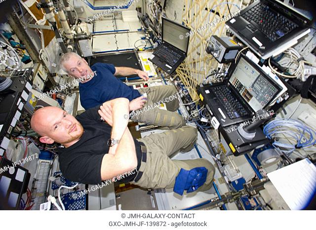 In the International Space Station's Destiny laboratory, NASA astronaut Steve Swanson (top), Expedition 40 commander; and European Space Agency astronaut...