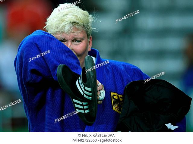 Jasmin Kuelbs of Germany (blue) reacts after loosing against Ksenia Chibisova of Russia (not pictured) during the Women +78 kg Elimination Round of 32 of the...