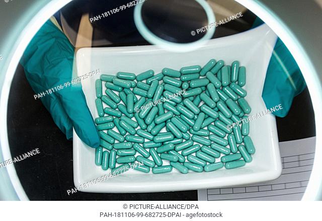 FILED - 20 June 2016, Hessen, Bad Vilbel: An employee checks the production of capsules at Stada Arzneimittel AG. (Zu dpa ""Last Days for Stada Shares - Offer...