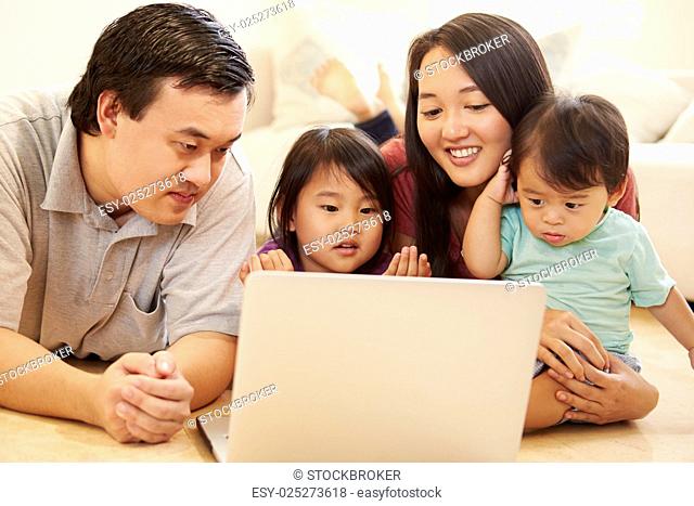 Family Watching Movie On Laptop At Home