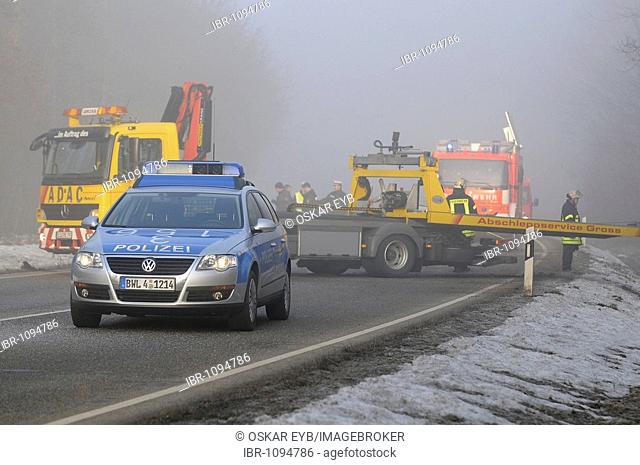 Police car and ADAC towing service at the accident scene after a severe traffic accident on L 1150, Esslingen, Baden-Wuerttemberg, Germany, Europe